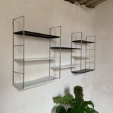 Vintage wall shelves in gold metal