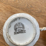 Porcelain cup with earthenware lions