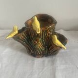 Old slipware birds on a tree trunk