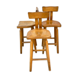 Trio of bent pinewood bar stools