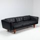 Illum Wikkelso model V11 sofa in black leather by Holger Christiansen, Denmark, 1960