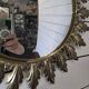 Witch's eye sun mirror in gold metal from the 60s