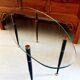 Table basse 1950 ovale en verre acier et laiton