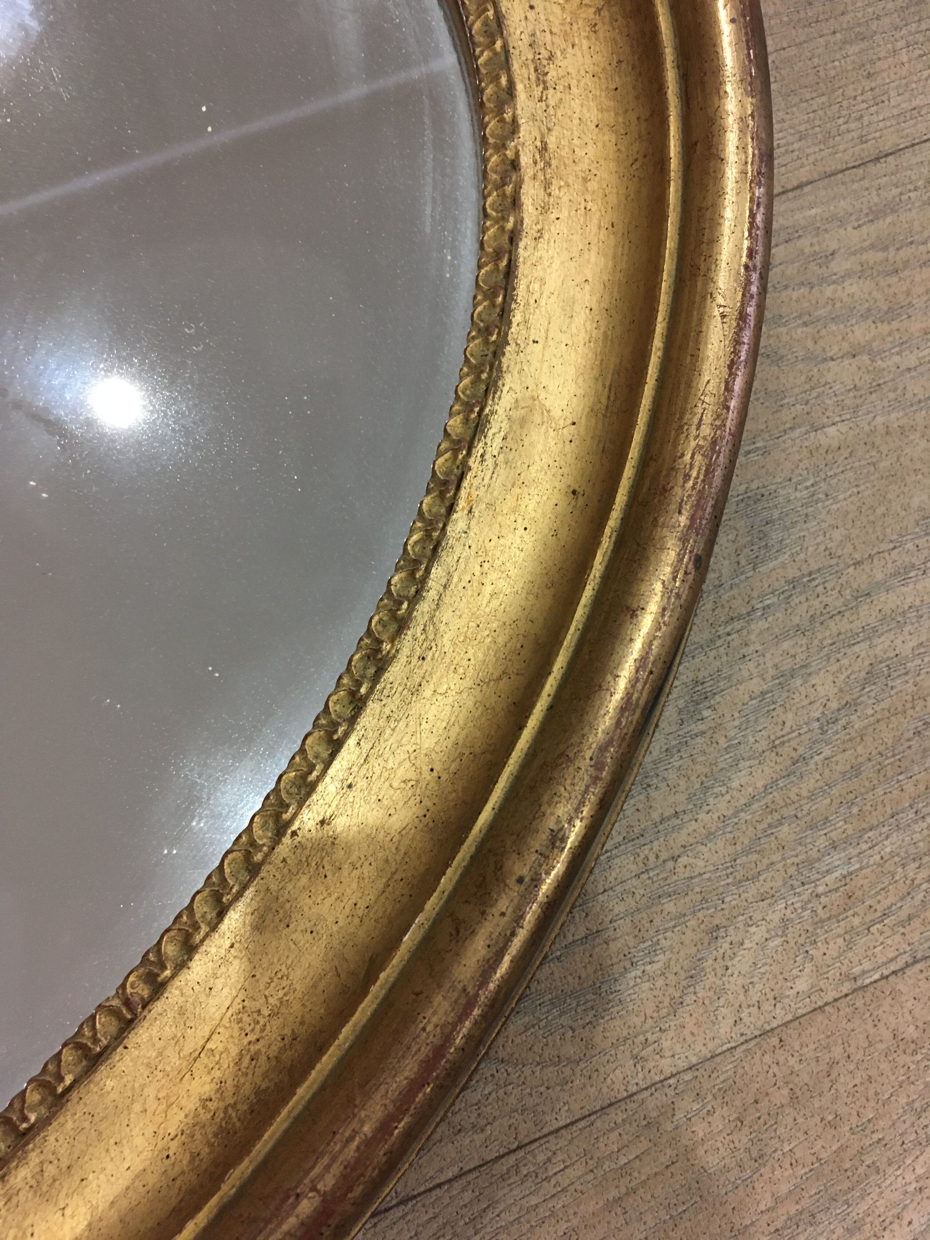 Old mirror gilded wooden frame.