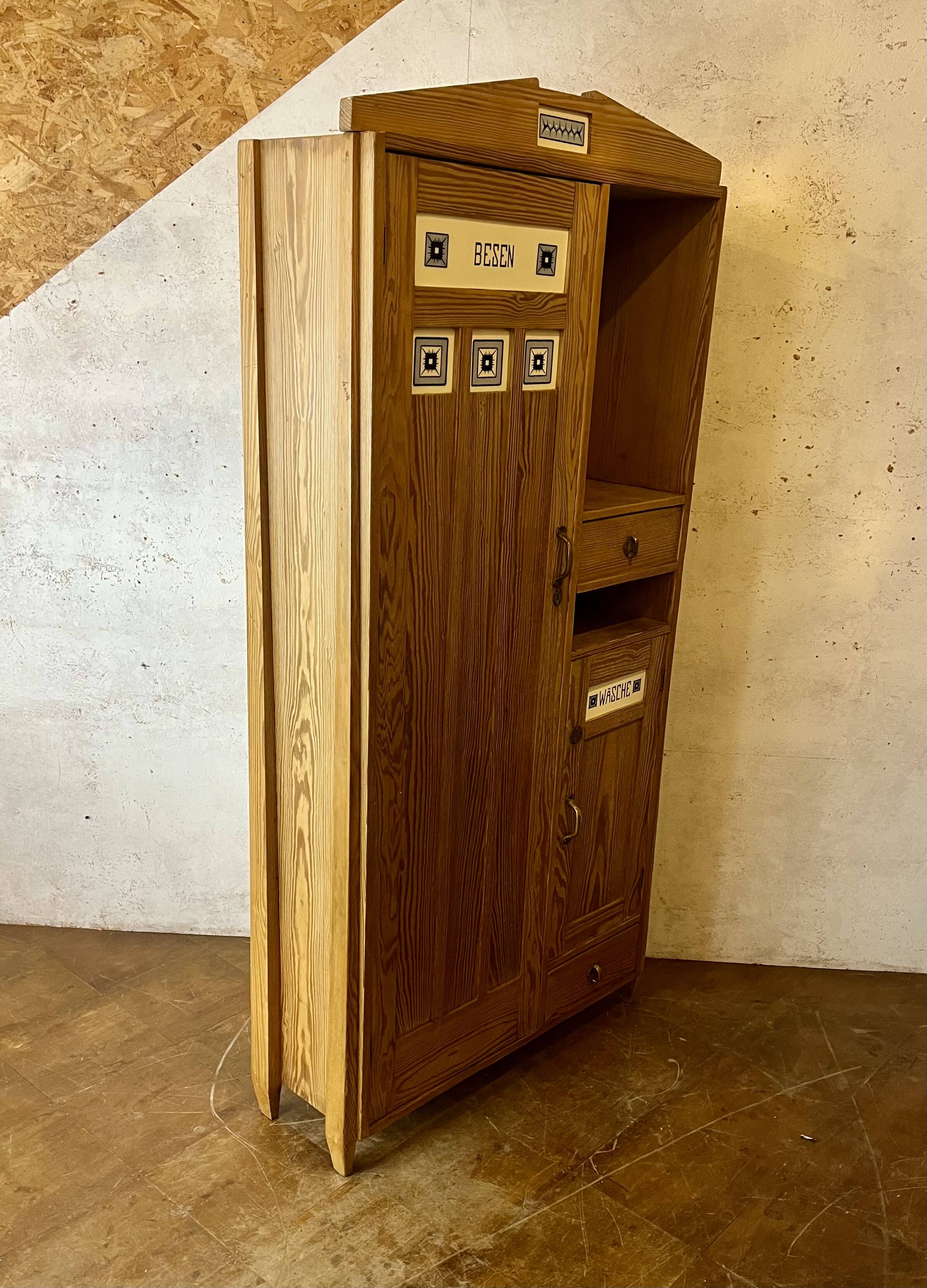 Art Nouveau wardrobe in pine with ceramic tiles, early 20th century.
