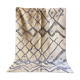 Berber cream carpet with blue patterns