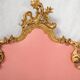 Italian rococo-style headboard in carved gilded wood, 19th century.