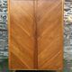 Mid-century wardrobe from the 1960s in wood, with a chevron front and tapered legs.