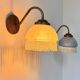 Pair of vintage wall lights in brass and blue-tinted glass, France 1970.
