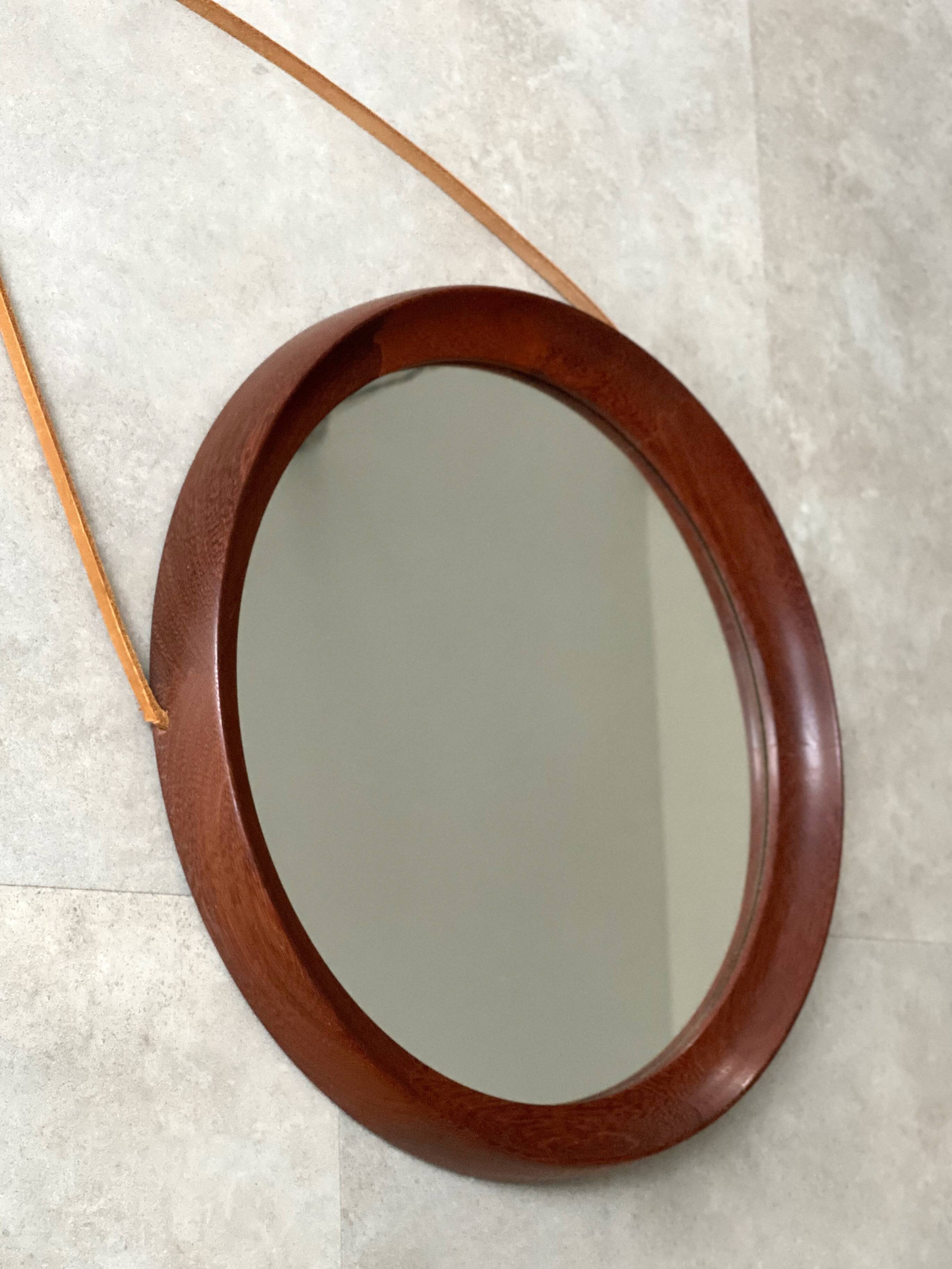 Mid Century solid teak wall mirror with a leather strap - Danish design