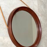 Mid Century solid teak wall mirror with a leather strap - Danish design
