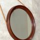 Mid Century solid teak wall mirror with a leather strap - Danish design
