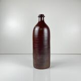 Duo of speckled stoneware and burgundy bottles, 20th century