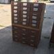 Brown wooden industrial wardrobe, multiple drawers, 1950s, workshop storage, Czech Republic.