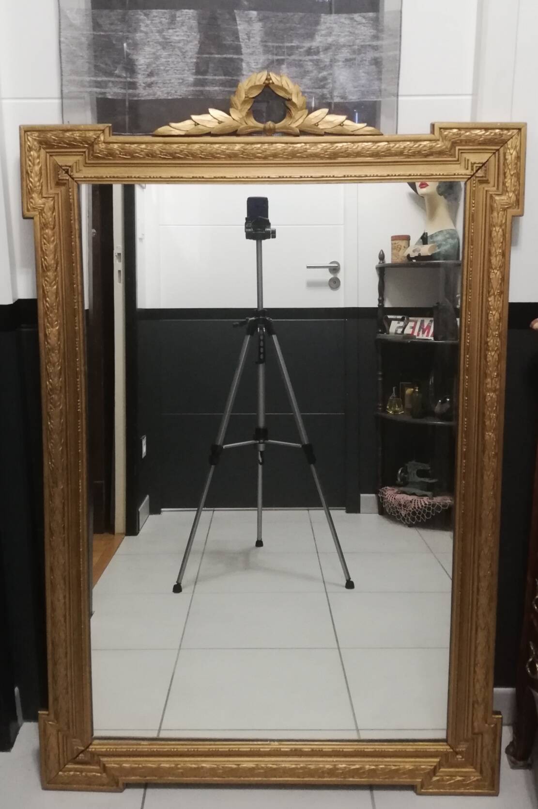 Carved wooden pediment mirror