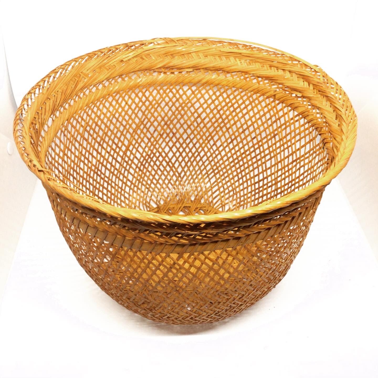 Openwork braided rattan basket