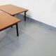 Suite of two vintage modernist Isa coffee tables in teak and black metal from the 60s