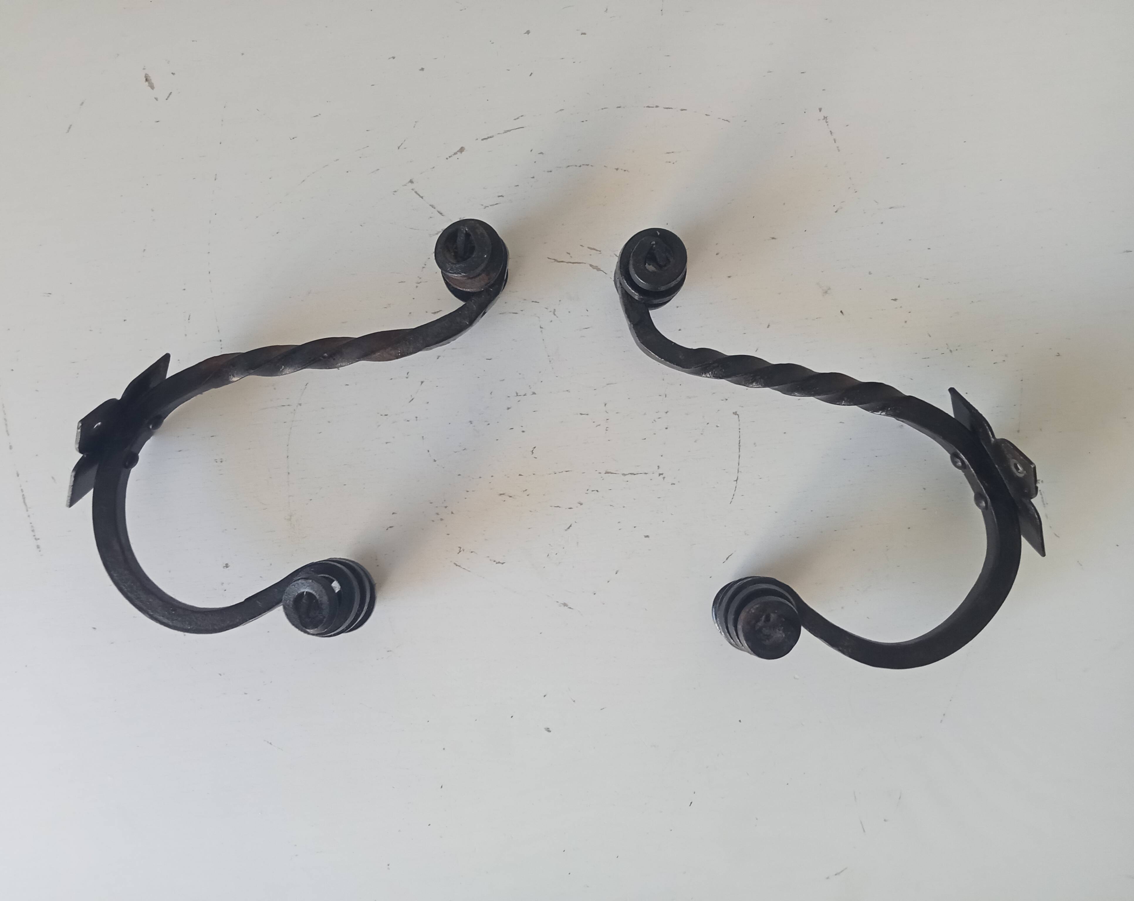 Brutalist wall coat rack in wrought iron.