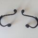 Brutalist wall coat rack in wrought iron.