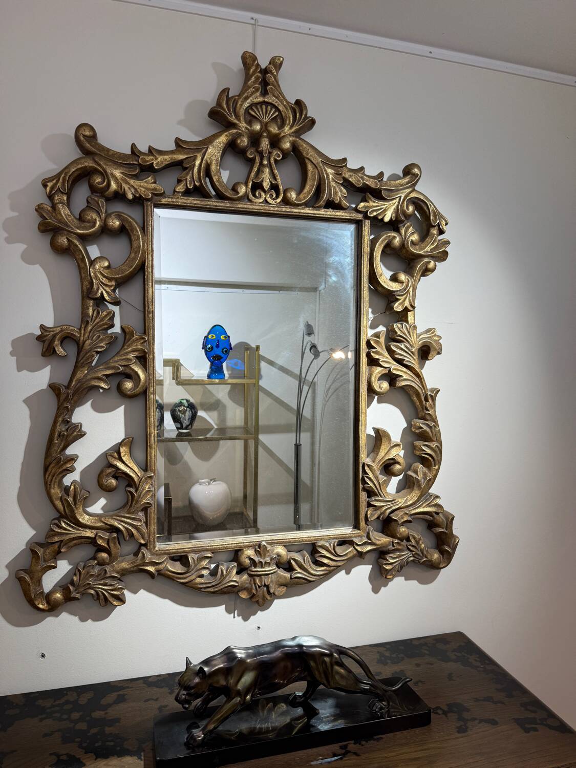 Gold wooden wall mirror with floral decoration