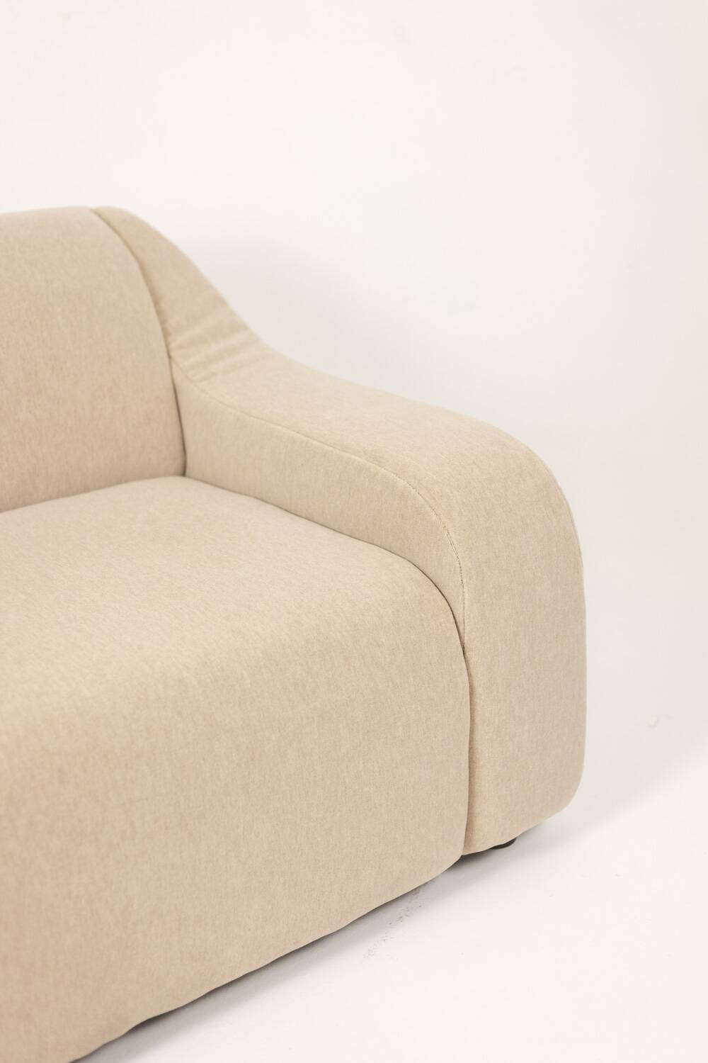 A pair of large and comfortable beige fabric armchairs. Contemporary.