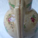 Antique pitcher decorated with flowers