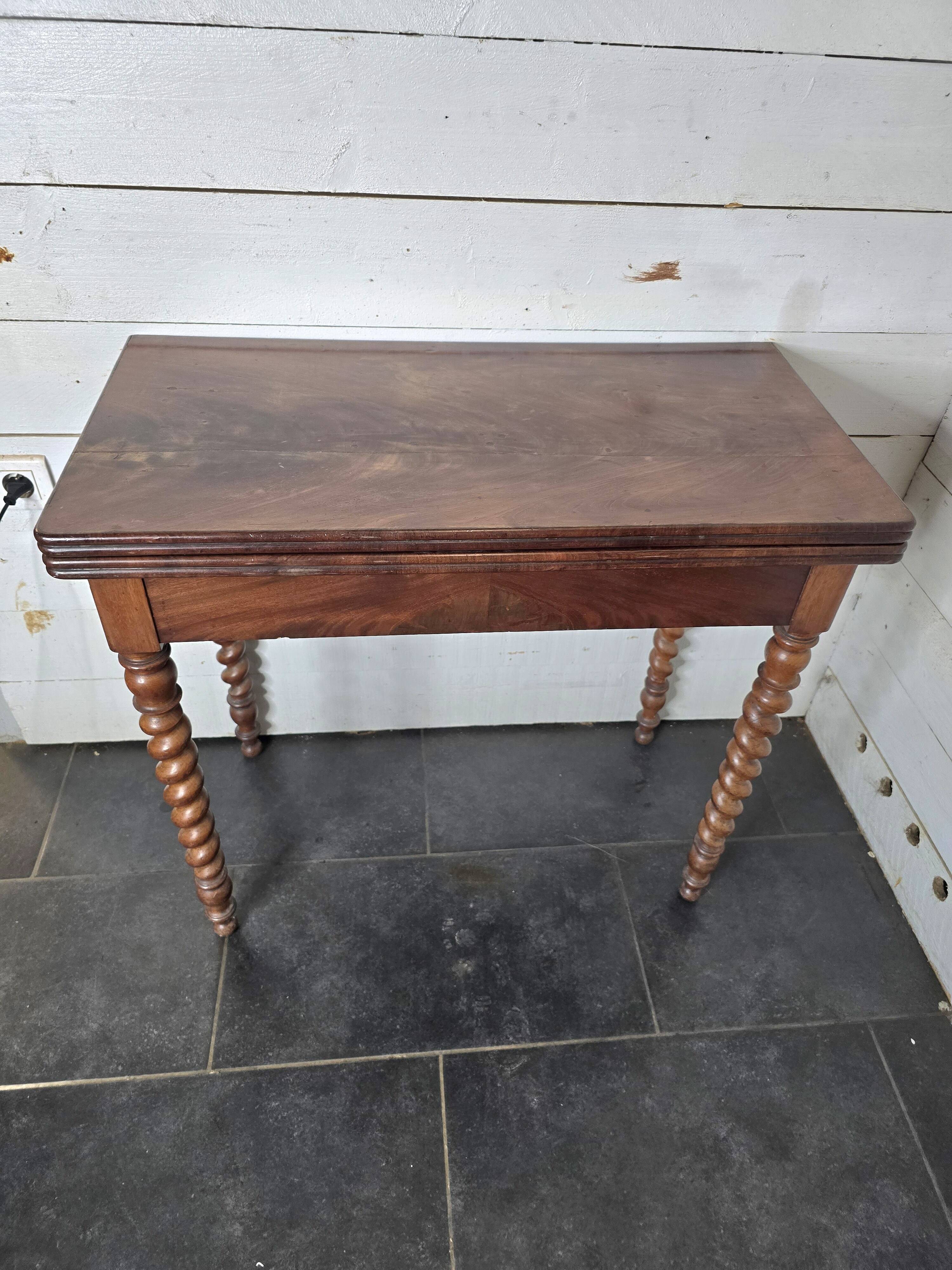 Old mahogany game table