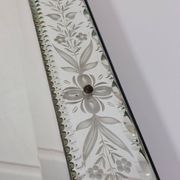 Venetian wall mirror in Murano glass with faceted floral decoration from the 1930s.