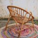 Fauteuil vintage « coquille » en rotin