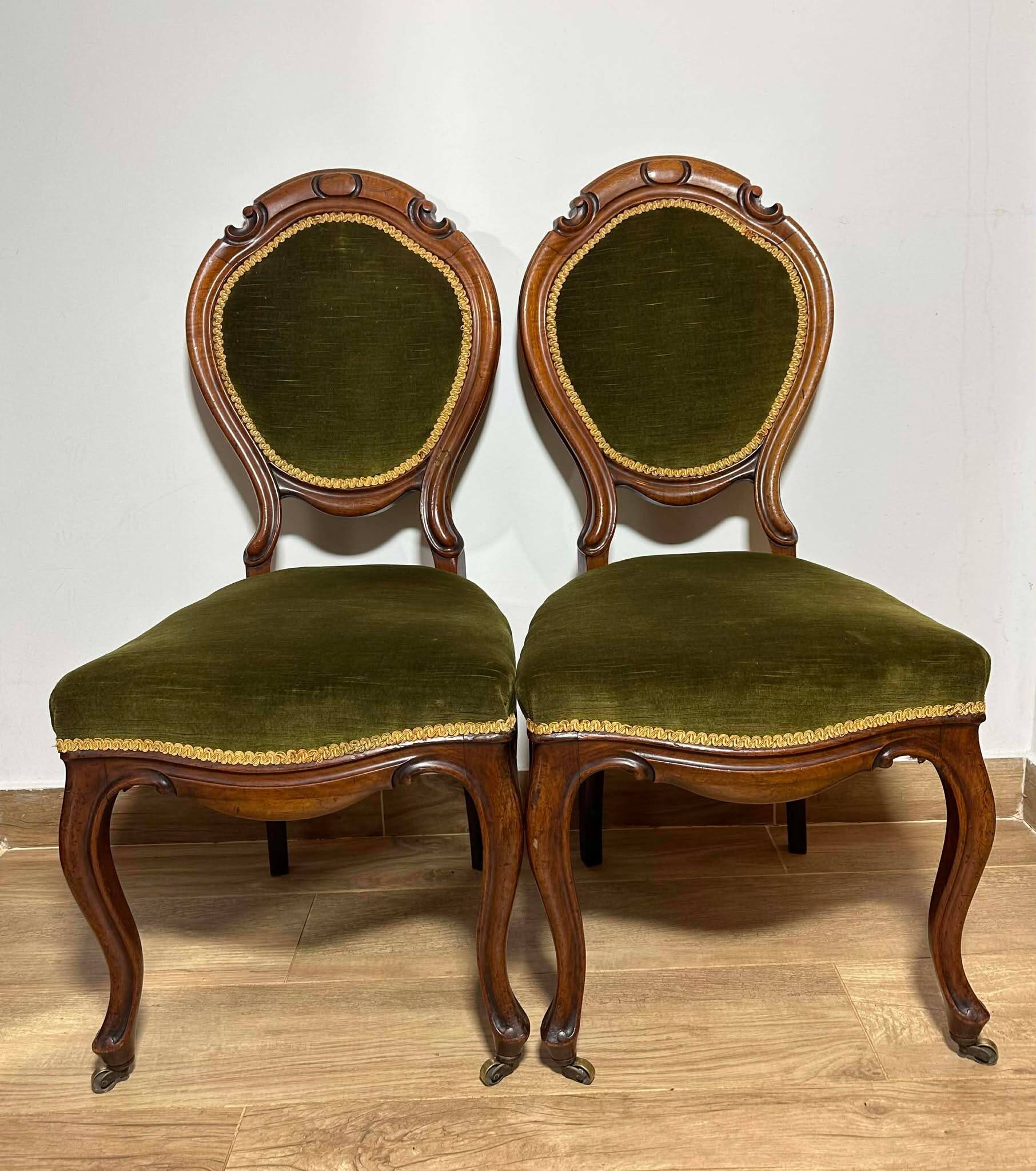 A pair of antique upholstered side chairs/Victorian balloon-back