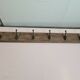 wooden school coat rack and iron hooks
