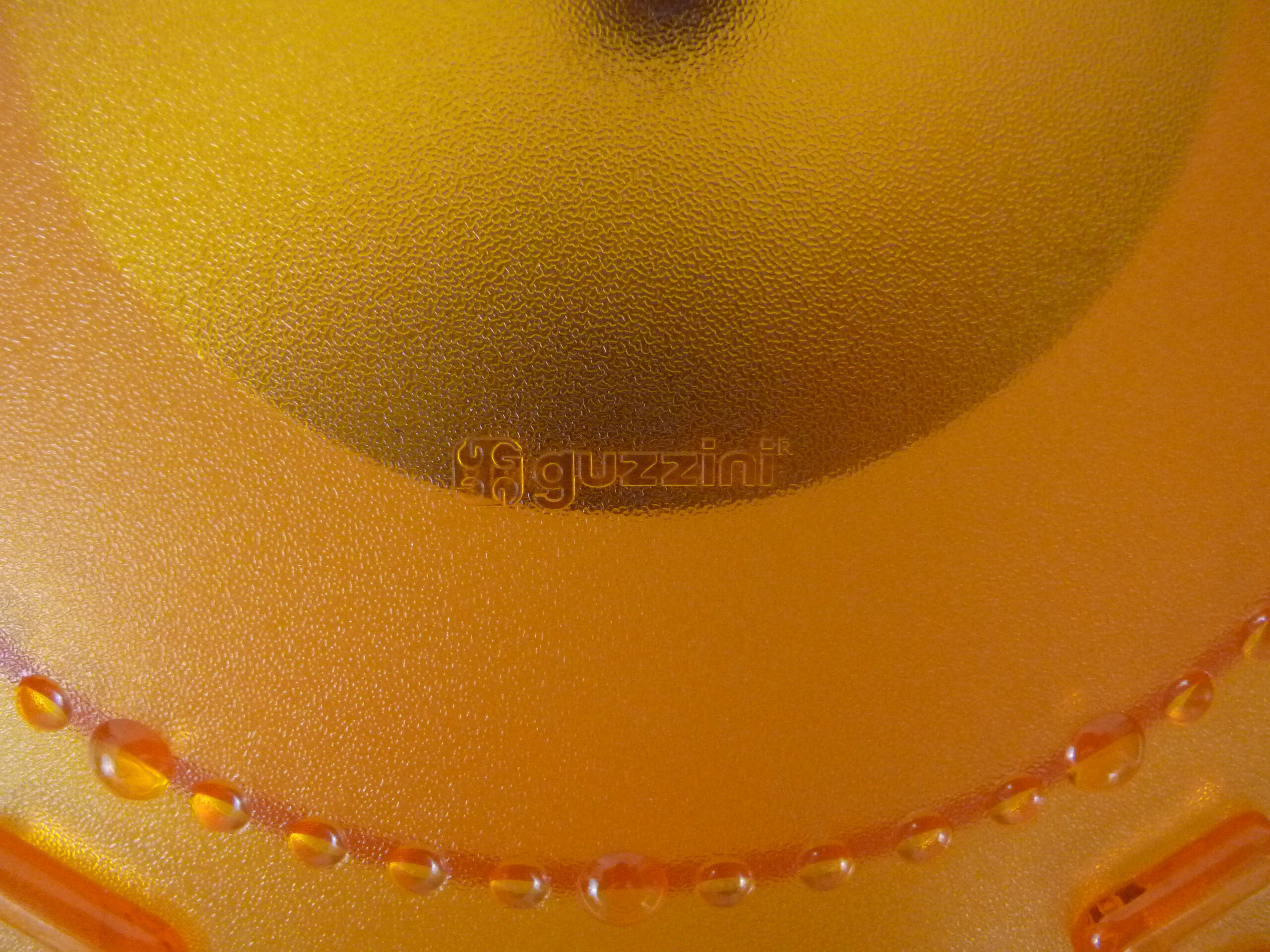 Guzzini orange wall clock from the 1980s