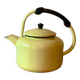 Old kettle in yellow enamelled sheet metal and Bakelite