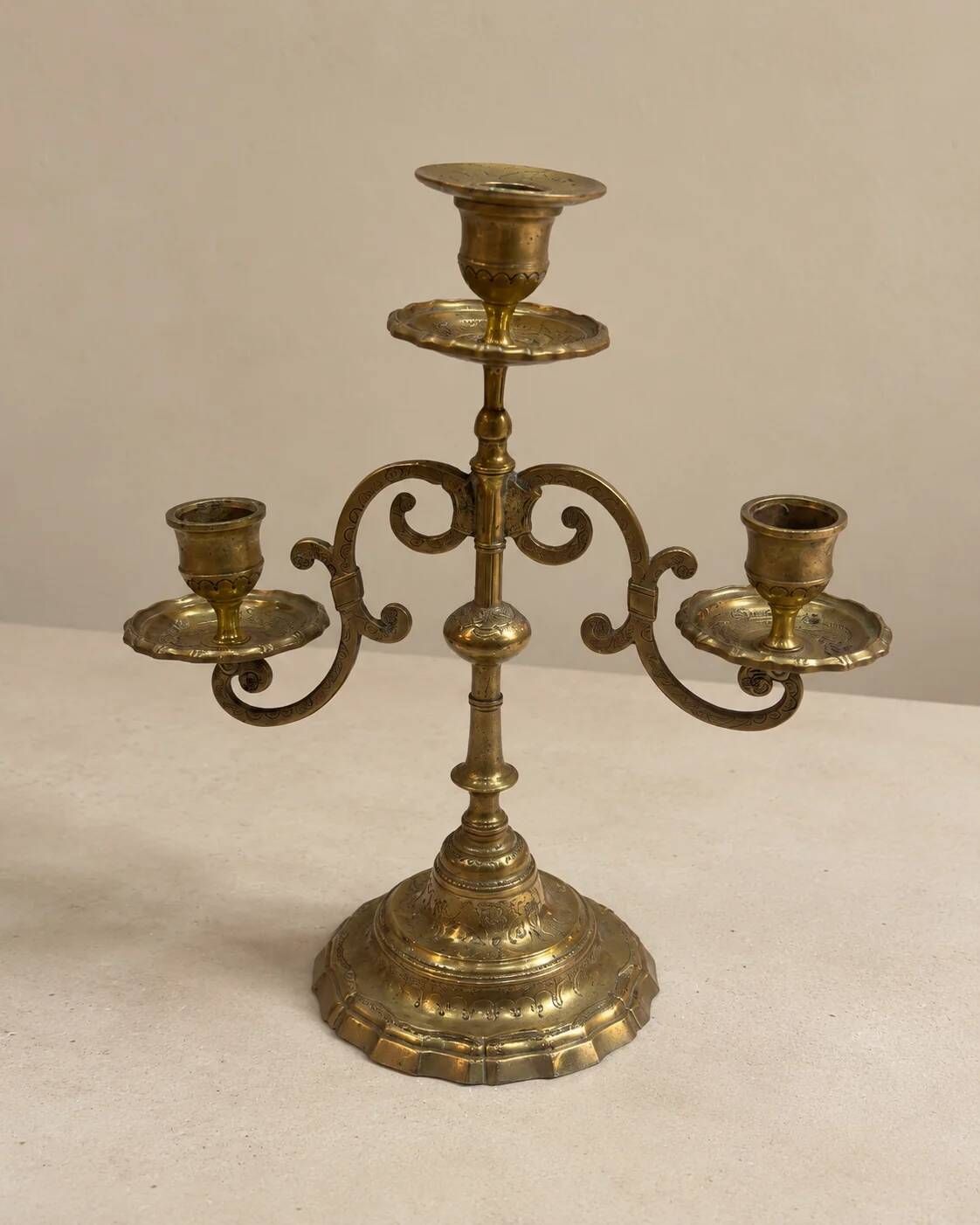 Three-light candelabrum in engraved brass — France, circa 1900