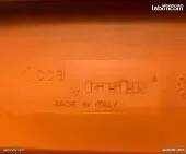 Two orange kicca chairs made in italy tbe