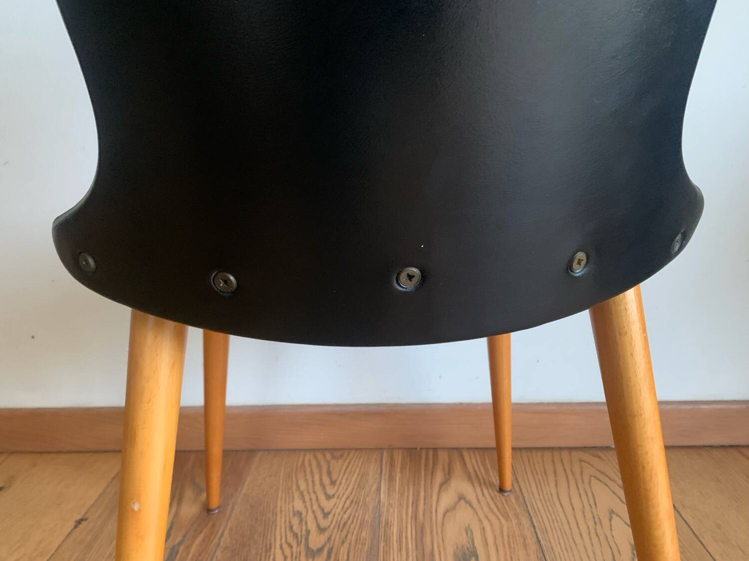 Black chair with compass legs