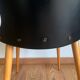 Black chair with compass legs