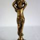 Pair of cherub candle holders in gilded bronze, early 20th century.