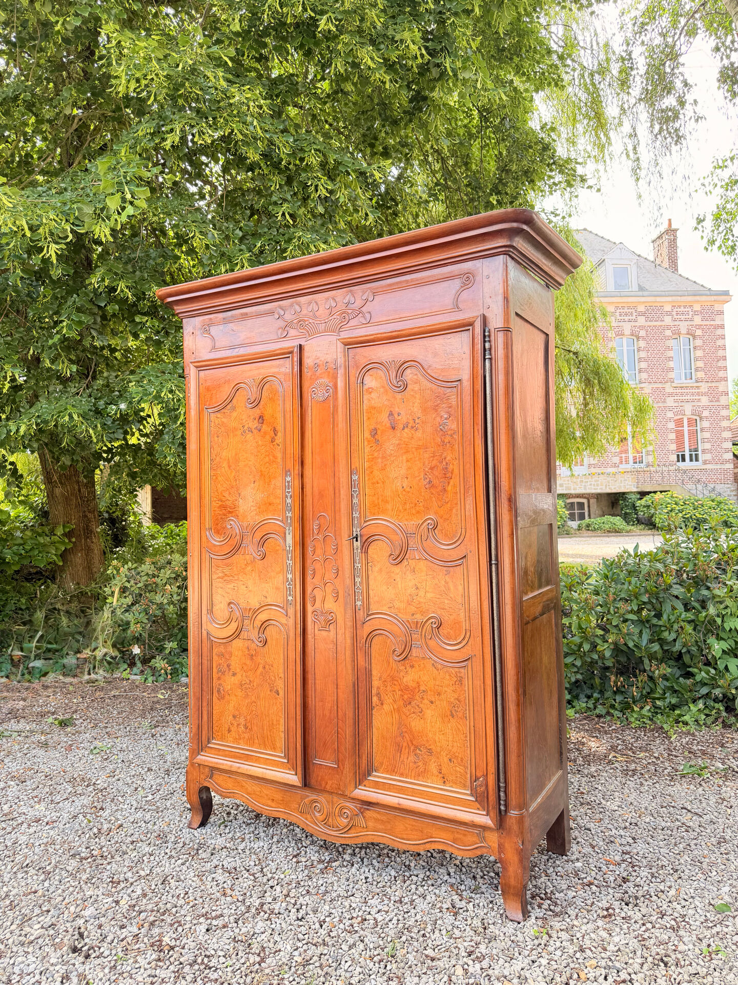 Bressane wardrobe in walnut in Louis XV style, 19th century.