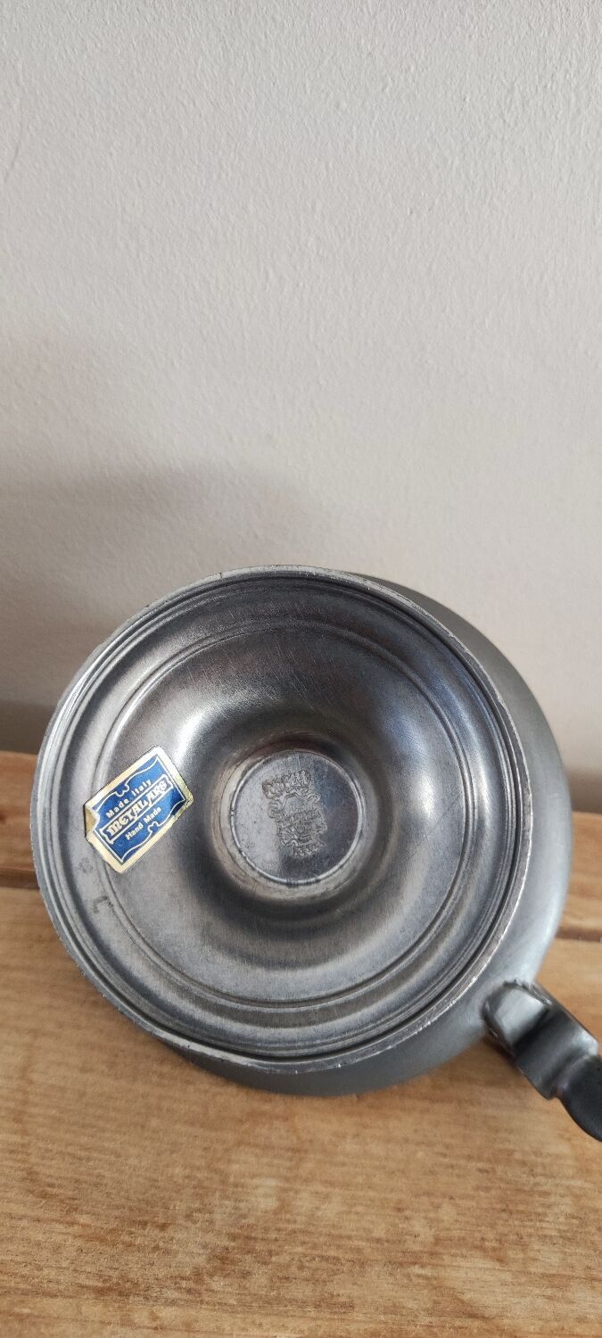 Tin hand candle holder.