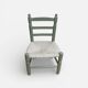 Child's chair in wood and straw revamped in almond green and white.