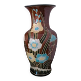 Large vintage antique vase with raised floral pattern.