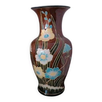 Large vintage antique vase with raised floral pattern.