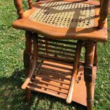Old baby high chair in wood and canework