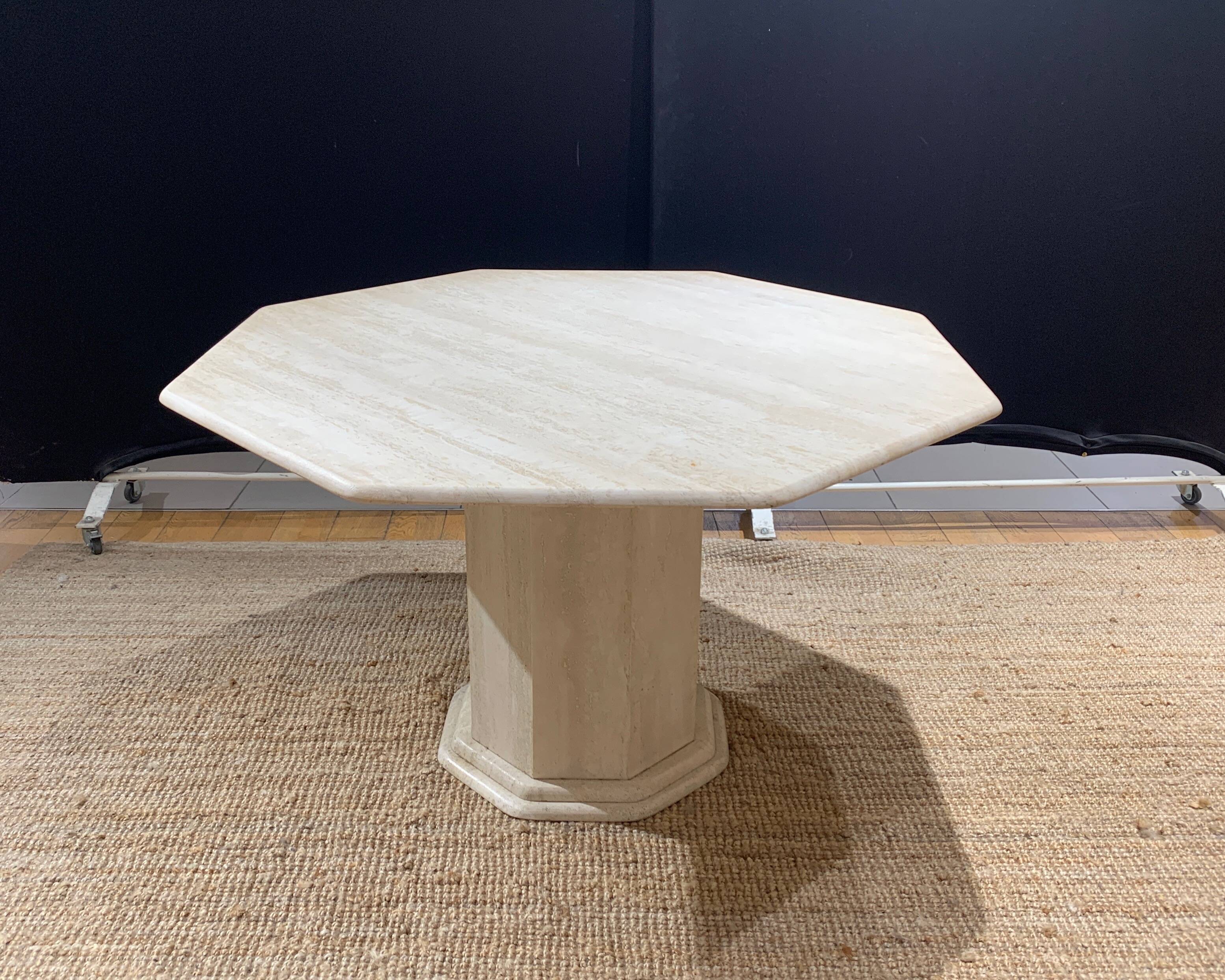 Octagonal table in light travertine