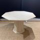 Octagonal table in light travertine