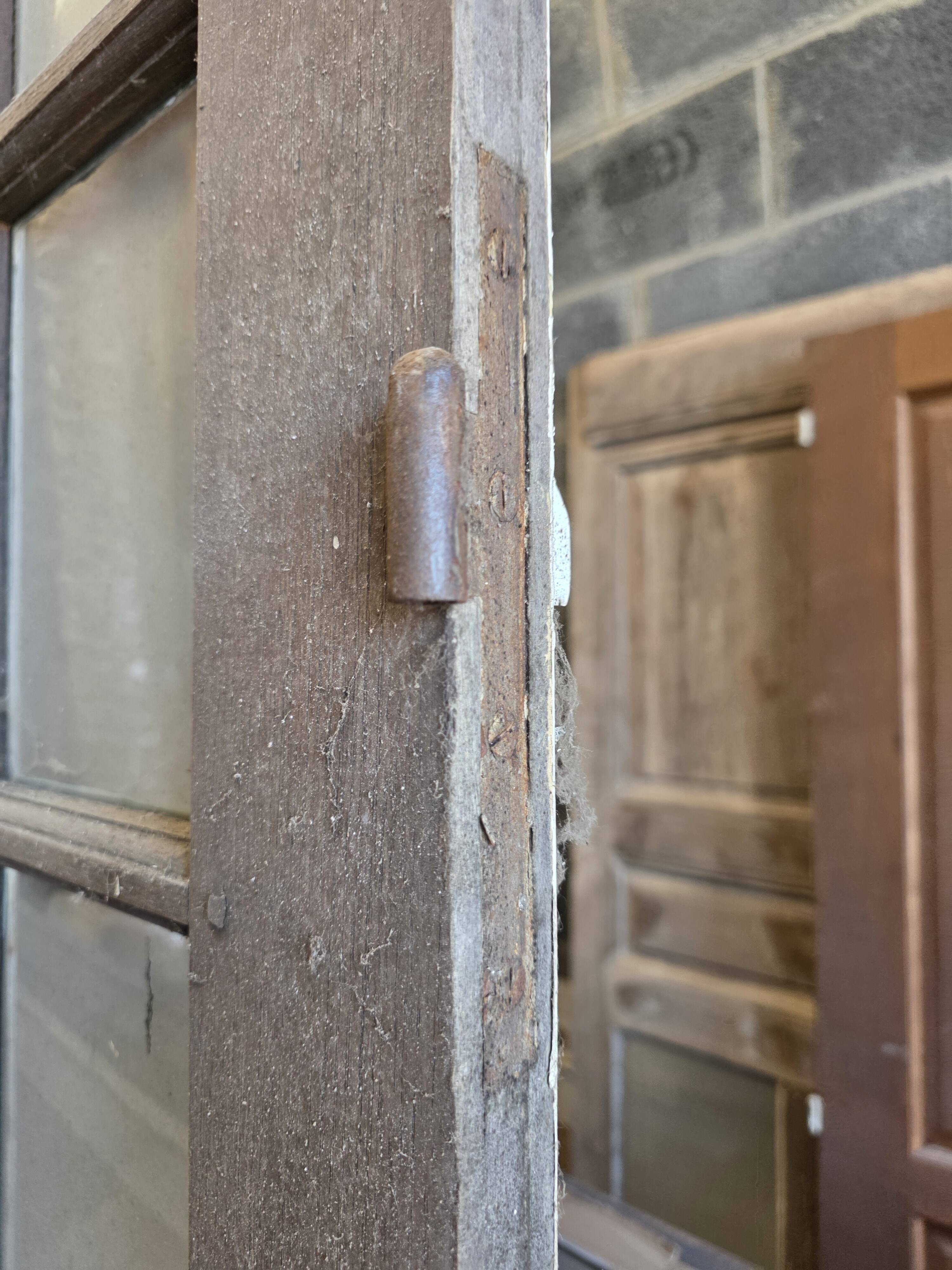 Two pairs of solid oak doors with small panes.