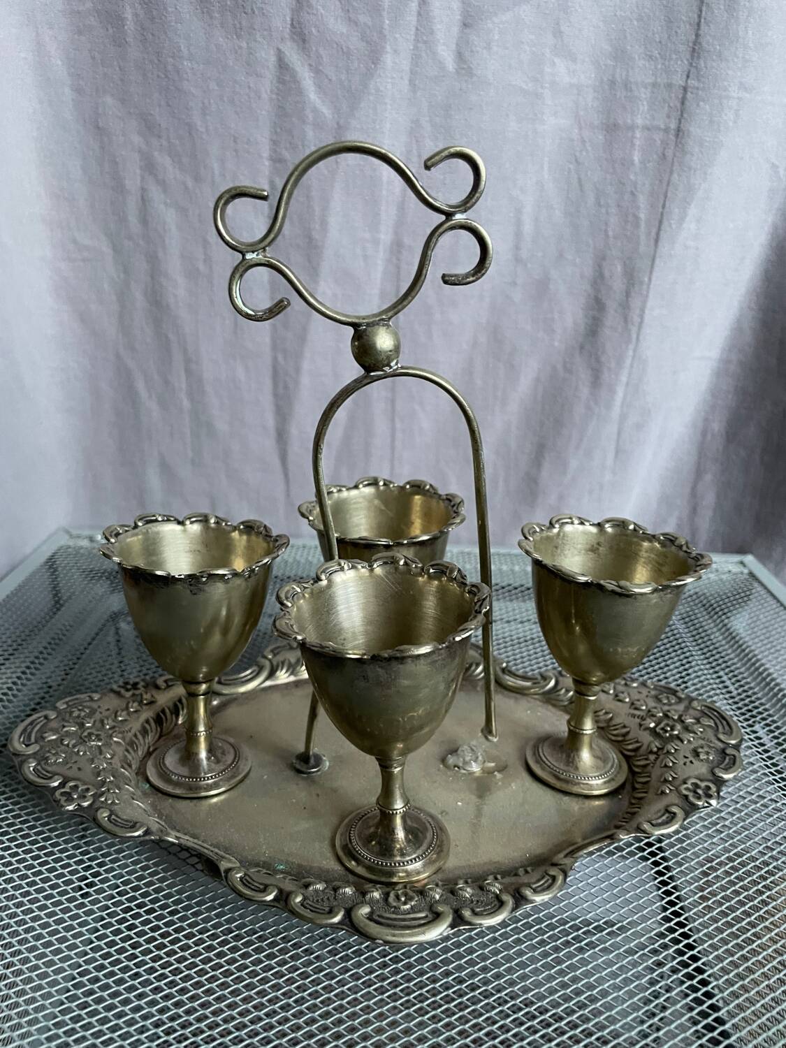 Antique egg set in nickel silver metal