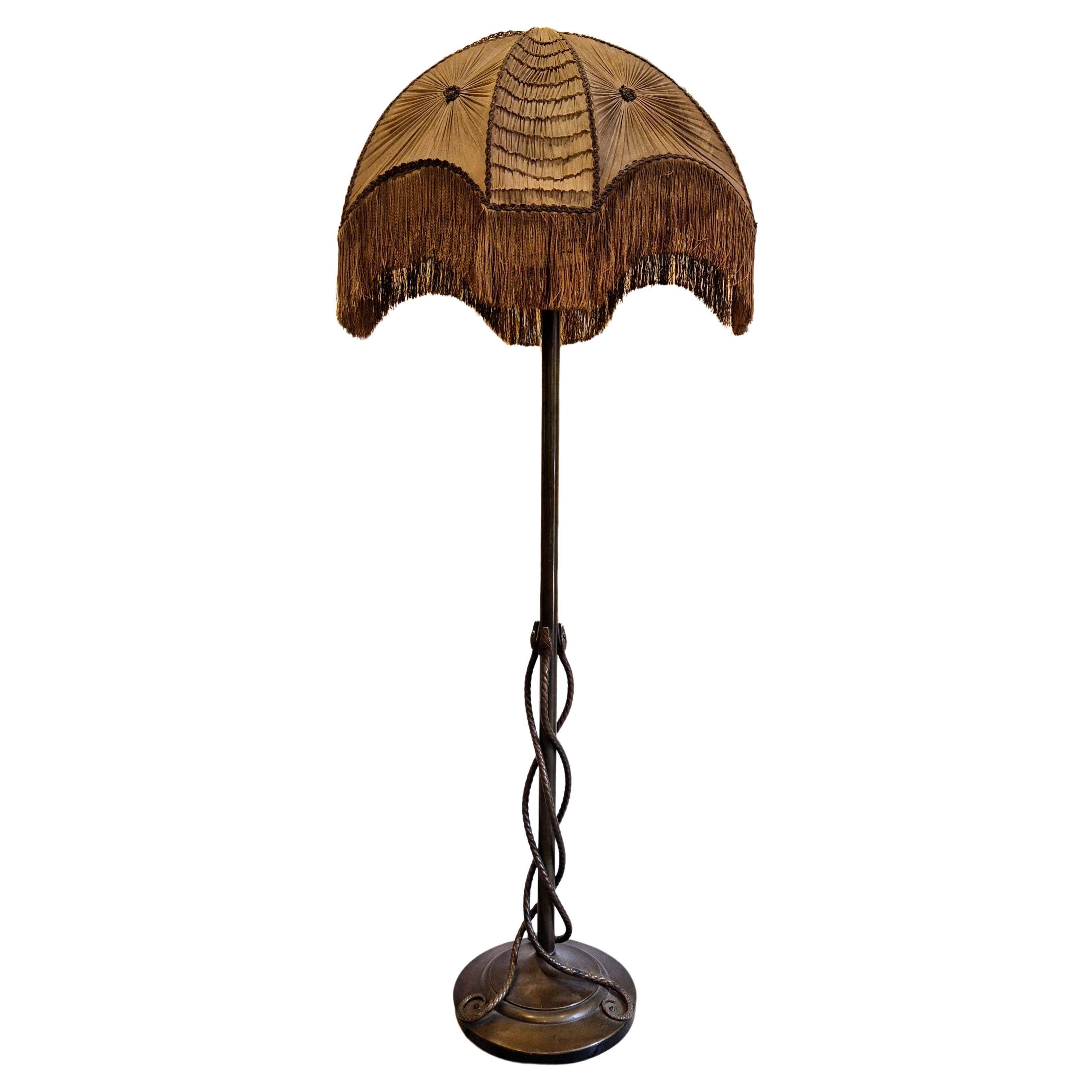 Rare and exquisite bronze floor lamp with intertwined snakes, early 1900s.