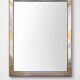 Faceted modernist wall mirror in steel and brass, geometric mixed metal frame 1970s.